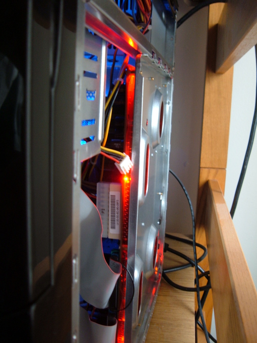 Who knew that the motherboard would have red LEDs on the bottom edges?  Not me.